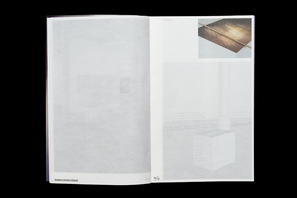 An open catalog spread with mostly blank white pages and a small photograph in the upper right corner showing what appears to be a wooden or bronze rectangular object on a light surface.